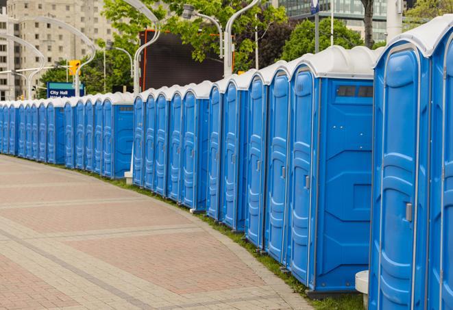 a row of portable restrooms at an outdoor special event, ready for use in Lagrange, IN